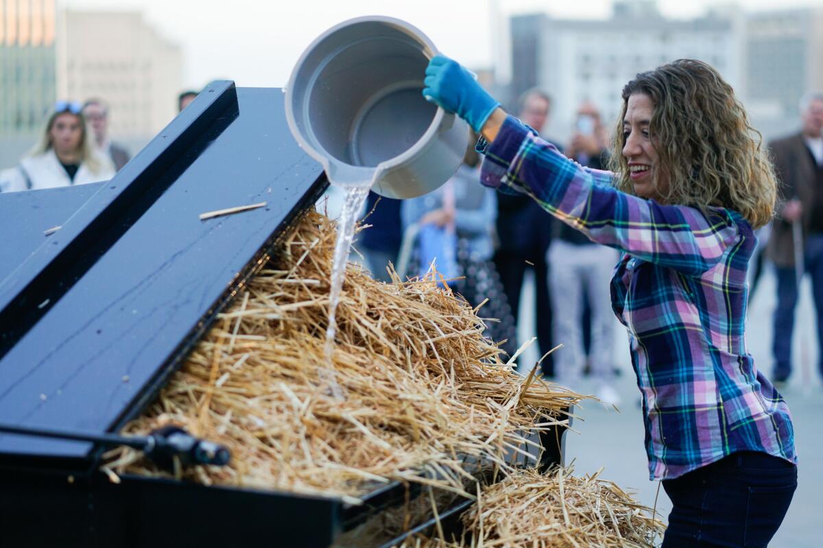 Joanne Pearce Martin gives the baby grand plenty of food and water on Thursday.