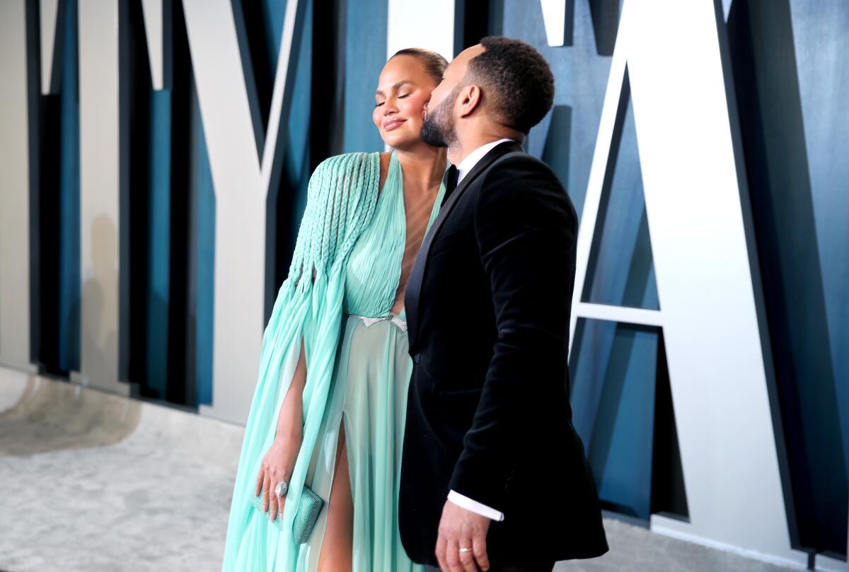 Chrissy Teigen shows off custom leggings featuring images of husband John  Legend on Instagram