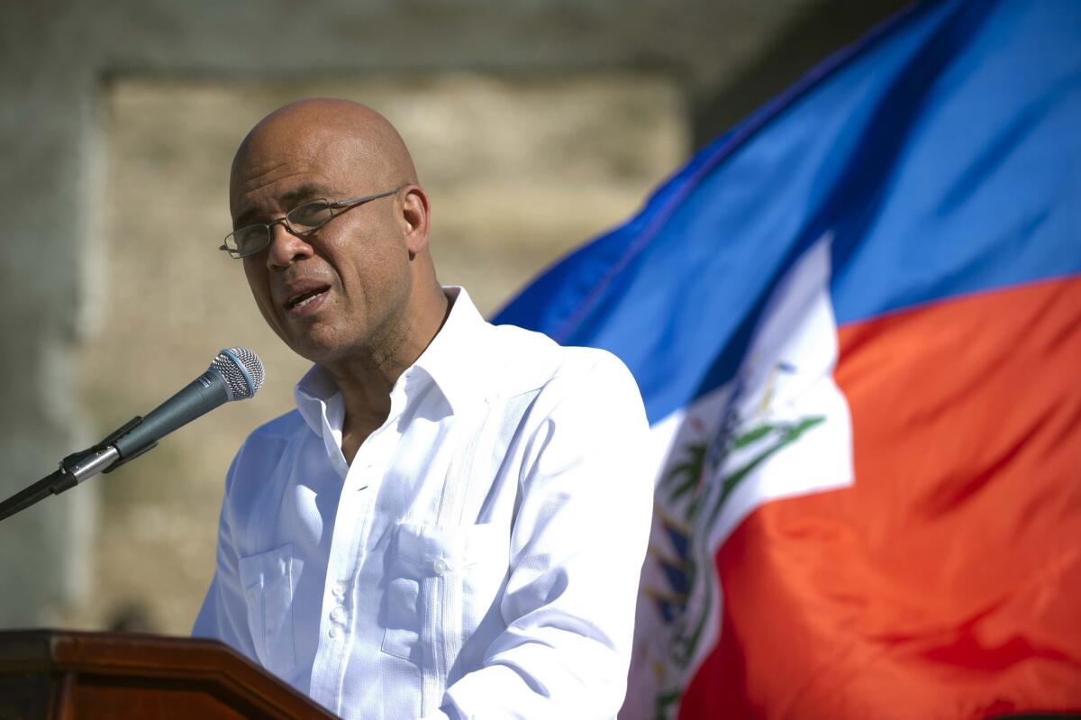 Haitian President Michel Martelly, shown at a memorial Jan. 2 in Titanyen honoring victims of the 2010 earthquake, has reportedly reached a deal with opposition leaders calling for elections this year.