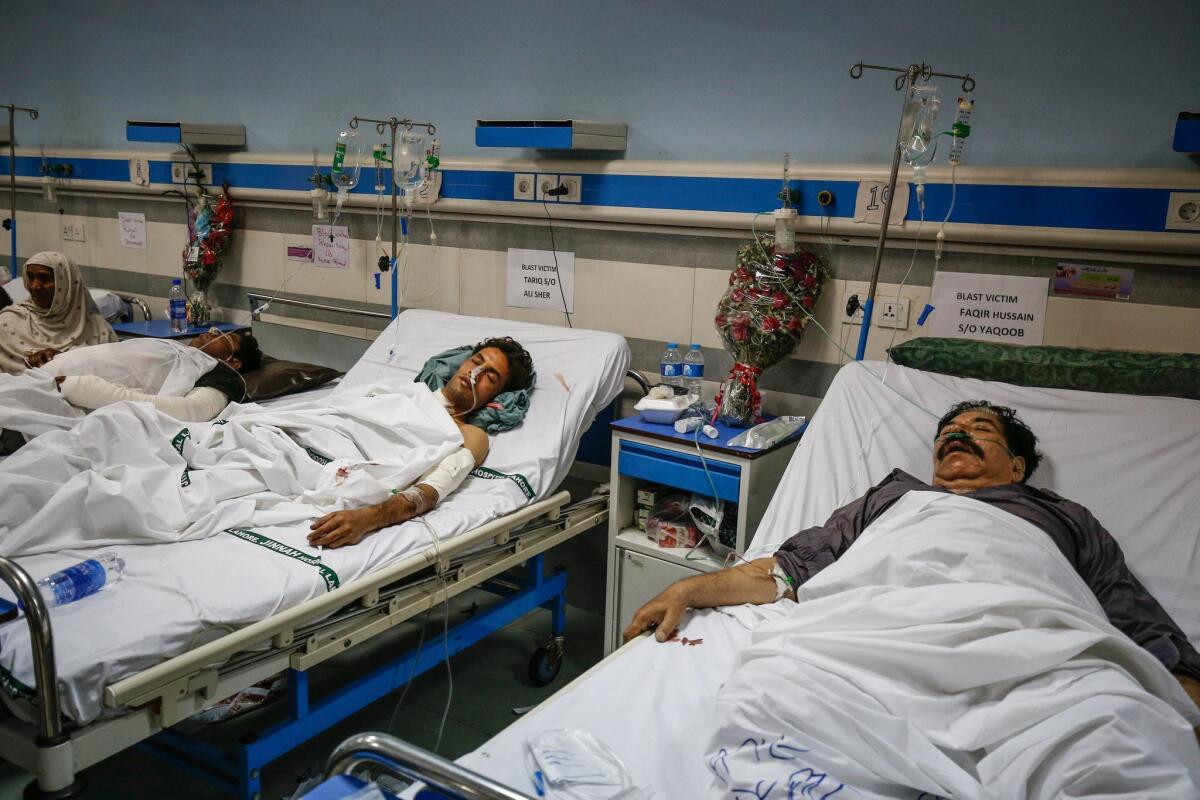 People who were injured in a suicide bomb attack are hospitalized in Lahore, Pakistan.
