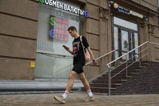 A man walks past a currency exchange office in Moscow, Russia, Monday, Aug. 14, 2023. The Russian ruble has reached its lowest value since the early weeks of the war in Ukraine as Western sanctions weigh on energy exports and weaken demand for the national currency. The Russian currency passed 101 rubles to the dollar on Monday, continuing a more than 25% decline in its value since the beginning of the year. (AP Photo/Alexander Zemlianichenko)