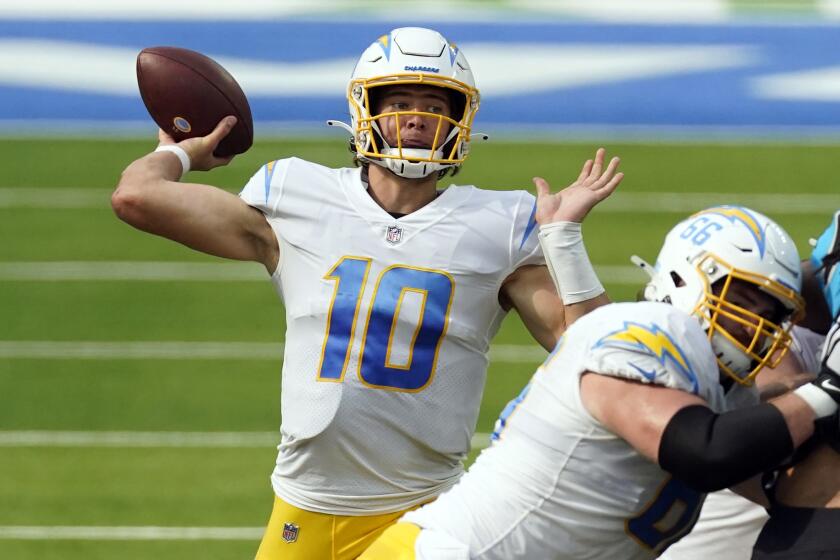 Los Angeles Chargers quarterback Justin Herbert (10) throws against the Carolina Panthers.