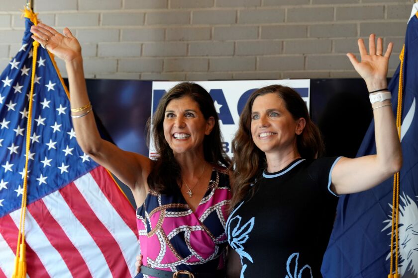 Former South Carolina Gov. Nikki Haley, left, cheers alongside U.S. Rep. Nancy Mace, right, during a campaign rally ahead of of South Carolina's GOP primary elections on Sunday, June 12, 2022, in Summerville, S.C. (AP Photo/Meg Kinnard)