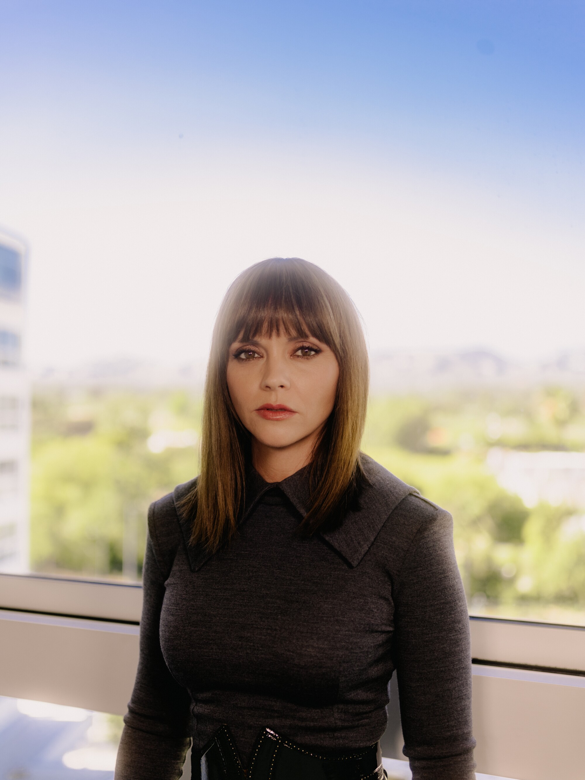 Christina Ricci photographed against the blue sky at the Beverly Hilton Hotel.