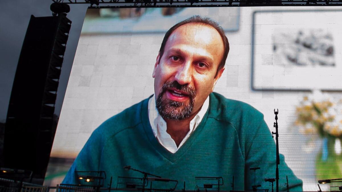Iranian filmmaker Asghar Farhadi speaks in a recorded video message during the public screening for his film "The Salesman" in London's Trafalgar Square.