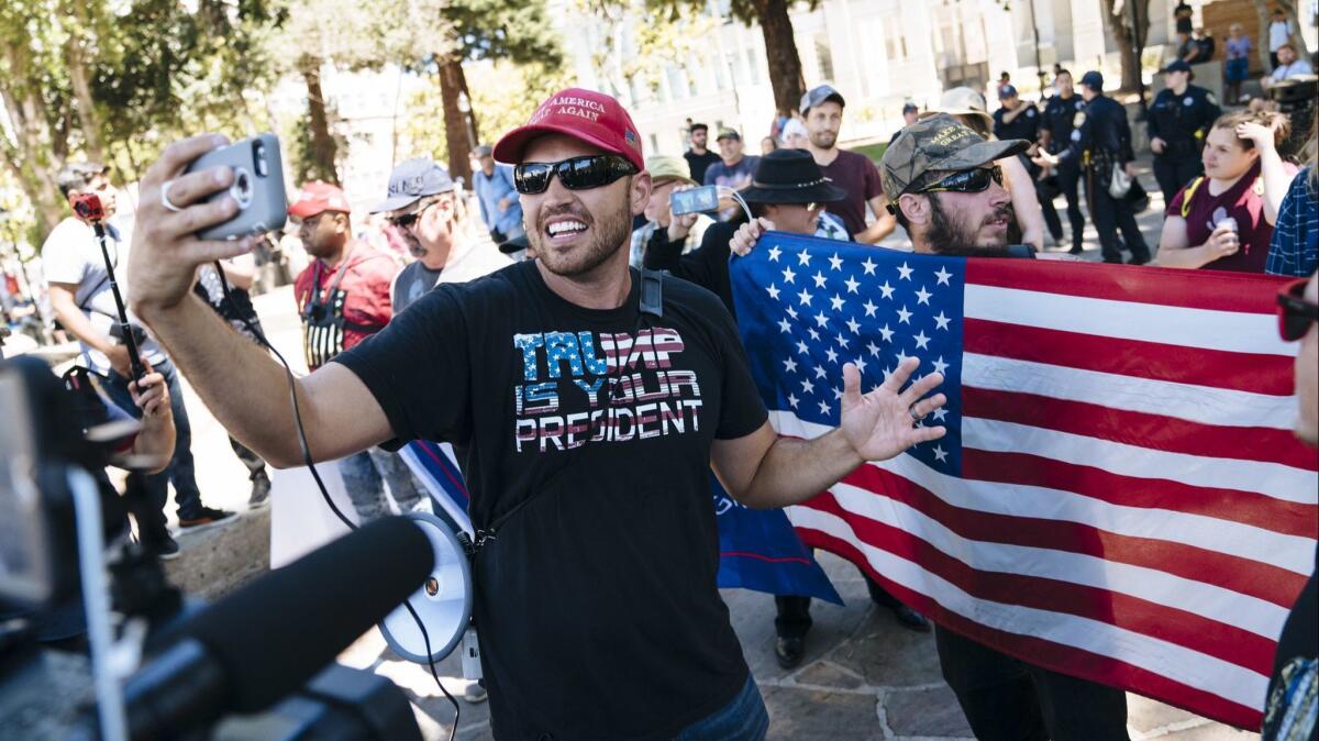 Ben Bergquam live-streams during a rally at the Martin Luther King Jr. Civic Center Park in Berkeley.