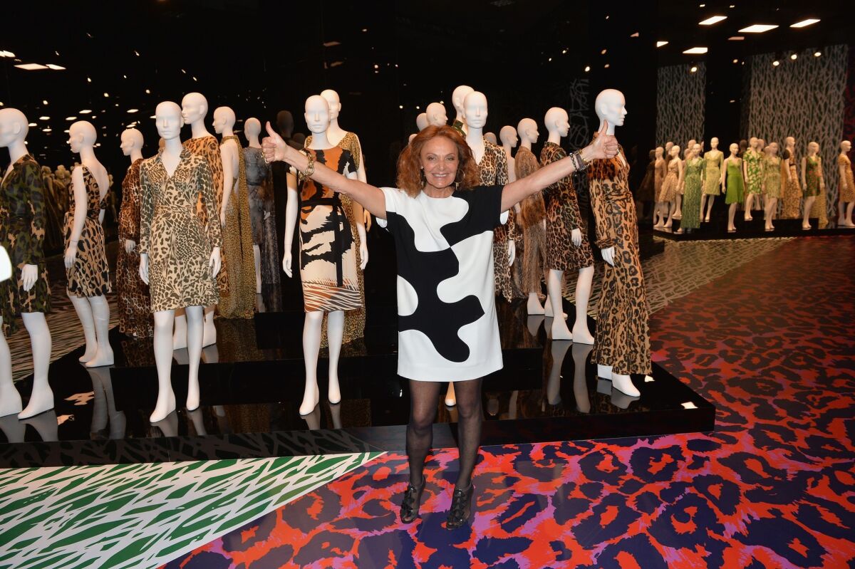 Designer Diane von Furstenberg with a collection of her wrap dress designs.