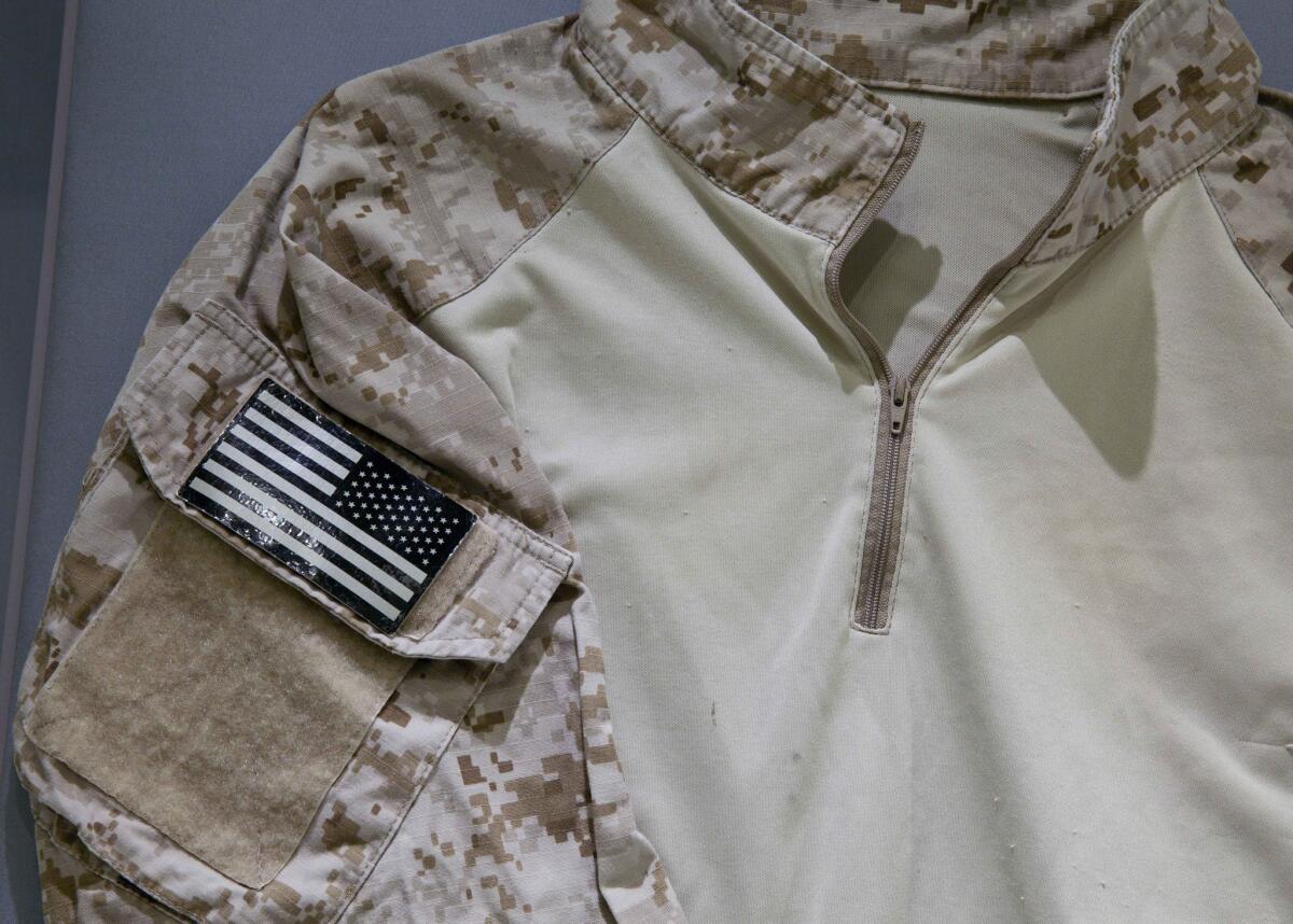 A fatigue shirt worn by a U.S. Navy SEAL during the mission to capture Osama bin Laden is part of a new display at the National September 11 Memorial and Museum in New York.