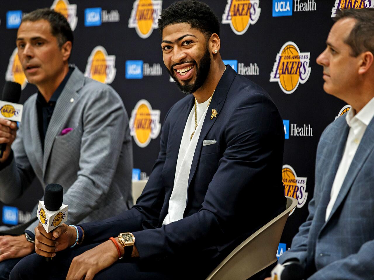 Lakers general manager Rob Pelinka, Anthony Davis and head coach Frank Vogel, from left, at a news conference introducing the Lakers’ new star in El Segundo on Saturday.