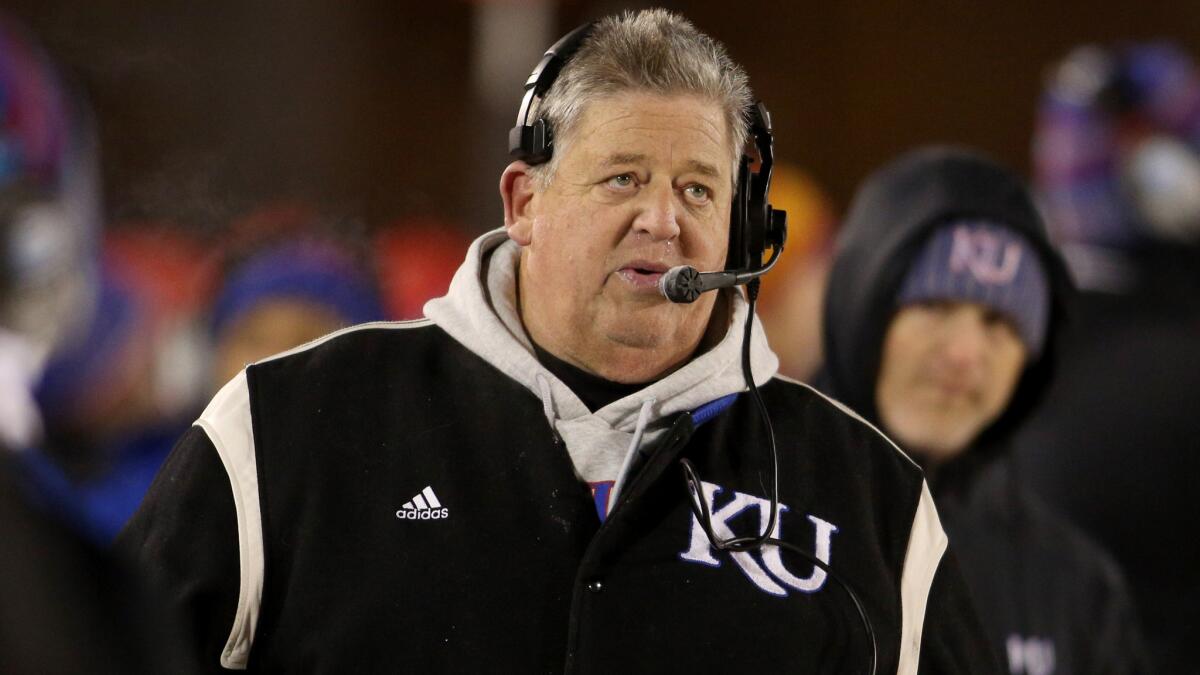 Kansas fired Coach Charlie Weis after the Jayhawks 23-0 loss to Texas on Saturday.