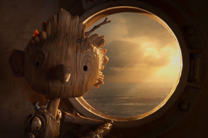 A wooden boy in front of portal displaying water in the animated movie "Guillermo del Toro's Pinocchio."