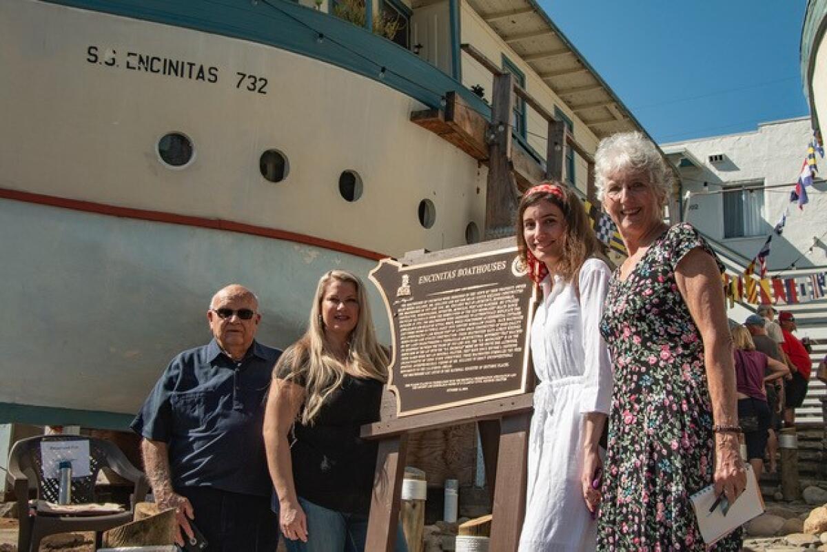 Four of the builder’s descendants, who came here for the dedication, posed with the commemorative plaque: Miles J. Kellogg, Stacy Alexander Karp, Rachel Brupbacher and her mother, Nancy Brupbacher.