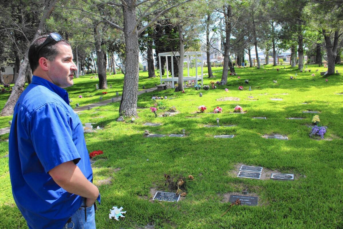 Justin Crumlish, who operates Gateway Pet Cemetery and Crematory with his wife, surveys the grounds in San Bernardino.