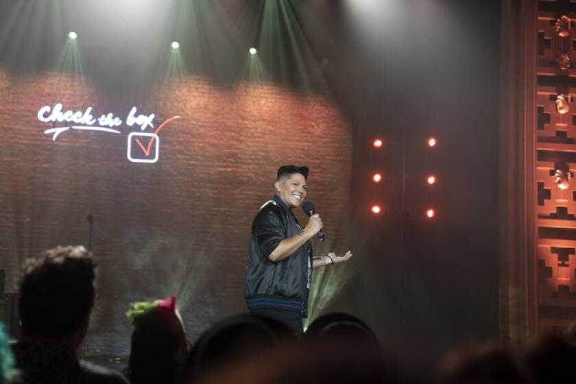 A stand-up comedian performs at a "comedy concert."