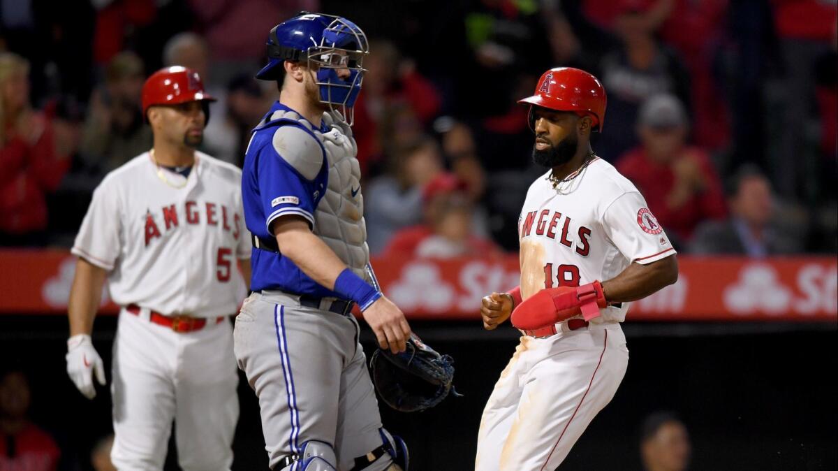 Blue Jays catcher Danny Jansen reacts as Brian Goodwin (18) of the Angels scores to take a 5-0 lead during the fourth inning at Angel Stadium on May 02, 2019