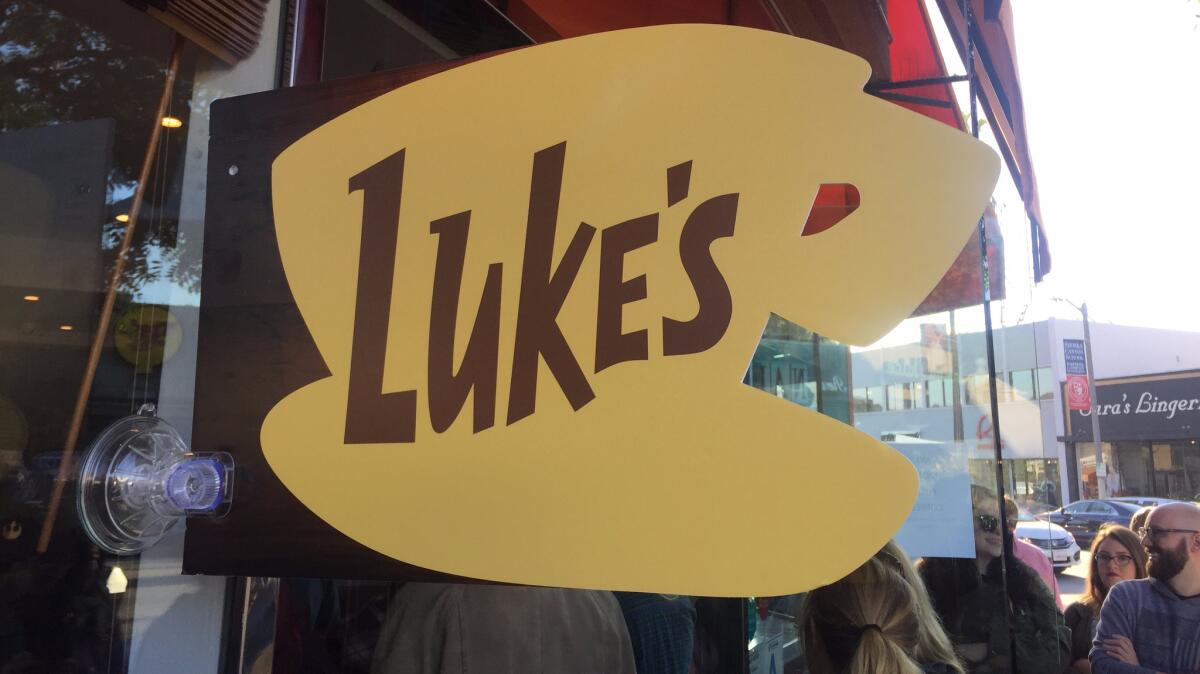 A sign for Luke's Diner outside Comoncy in Studio City.