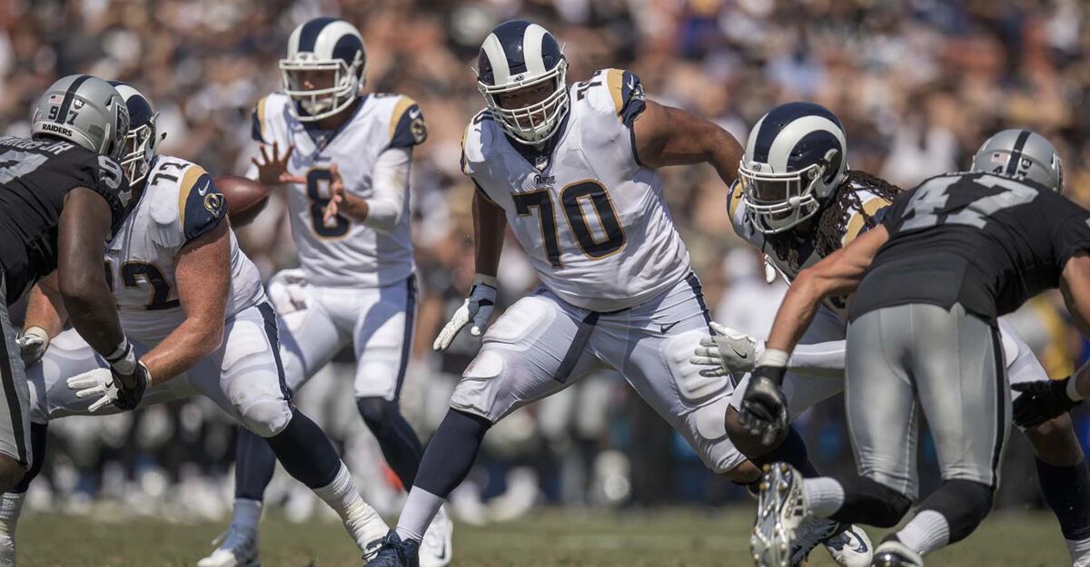 Rams offensive lineman Joe Noteboom (70) pass protects during a preseason game.