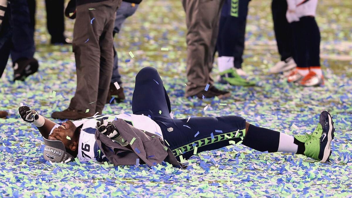 Russell Okung celebrates after winning Super Bowl XLVIII as a member of the Seattle Seahawks on Feb. 2, 2014.