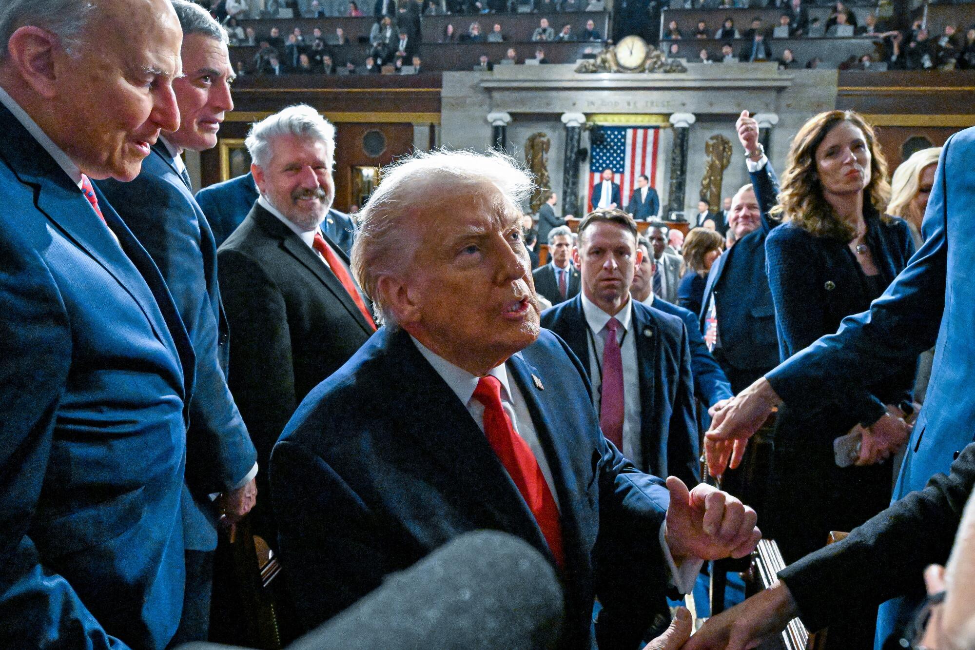 President Donald Trump exits the House Chamber after delivering the State of the Union address.