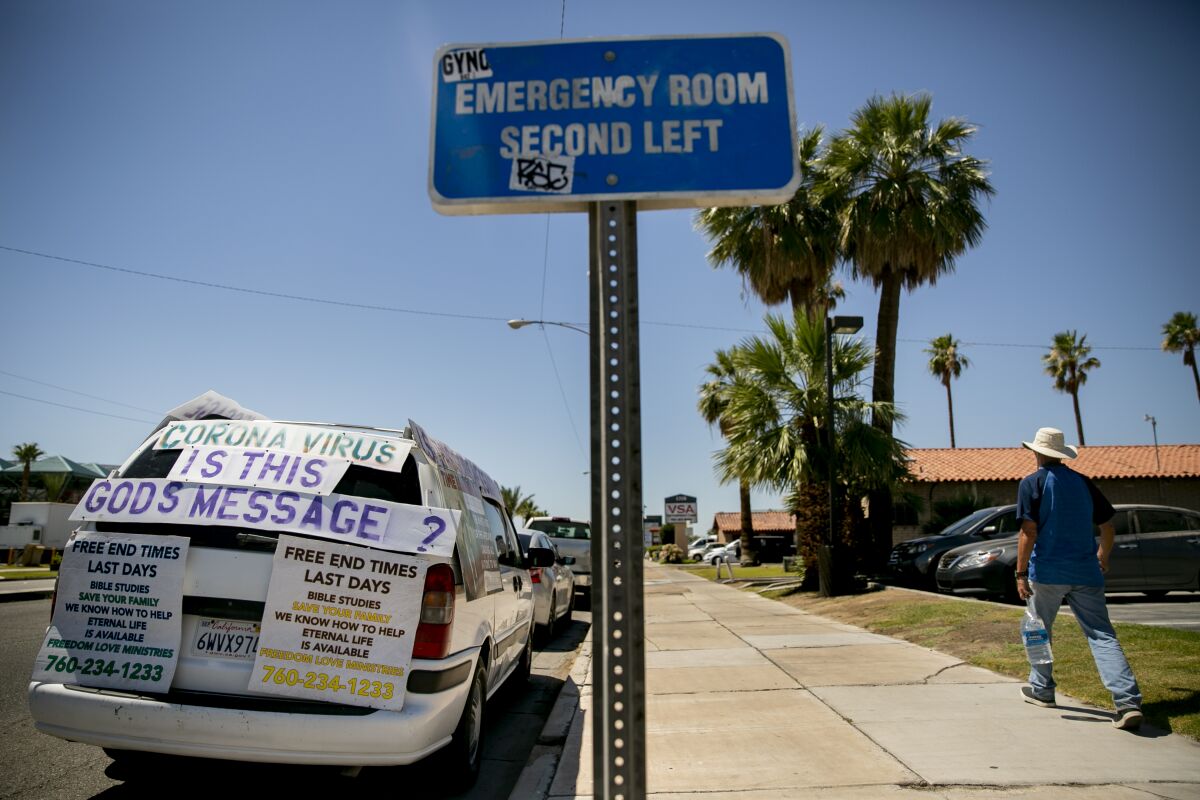 A van with lots to say is parked outside of the El Centro Regional Medical Center.