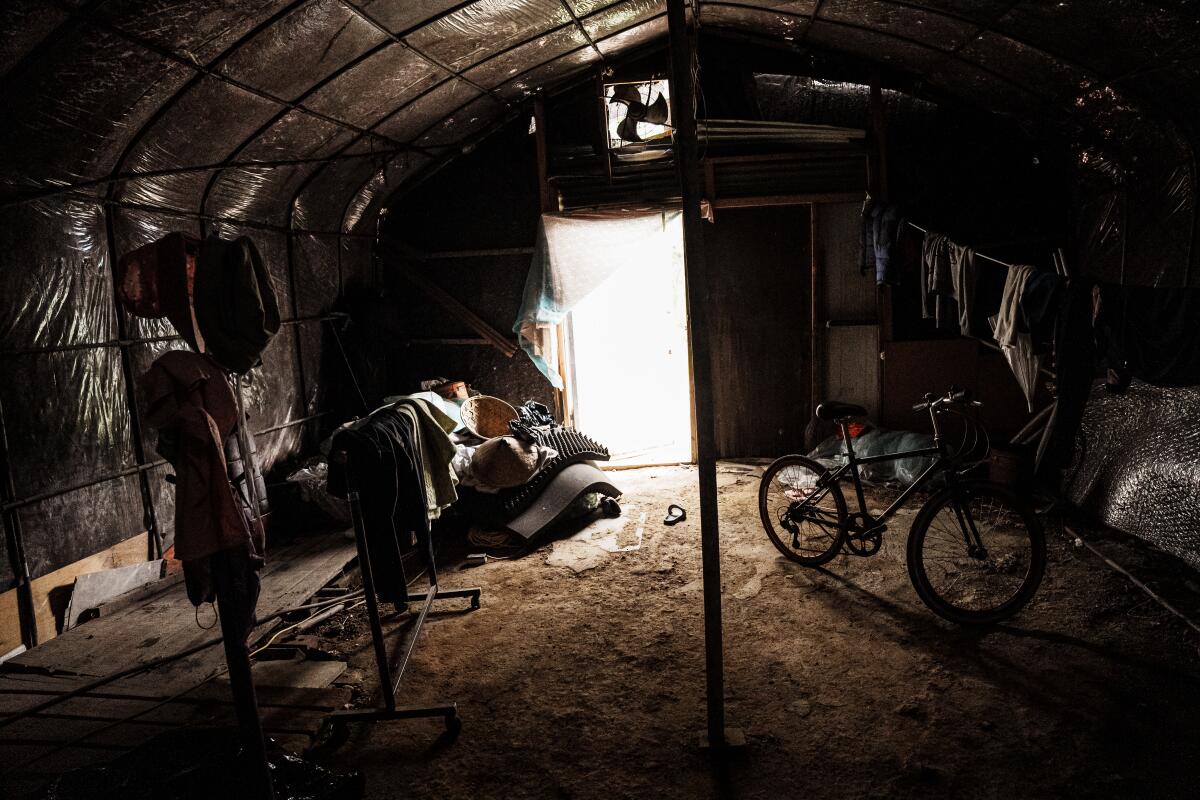 Inside makeshift housing on farms, where living conditions are often squalid and spartan.