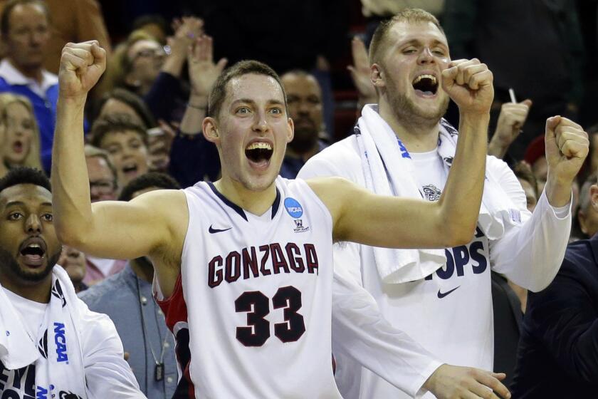 Gonzaga forward Kyle Wiltjer (33) and Przemek Karnowski, right, celebrate in the final seconds of the Bulldogs win over Iowa. Gonzaga next plays UCLA, who it defeated earlier this season.
