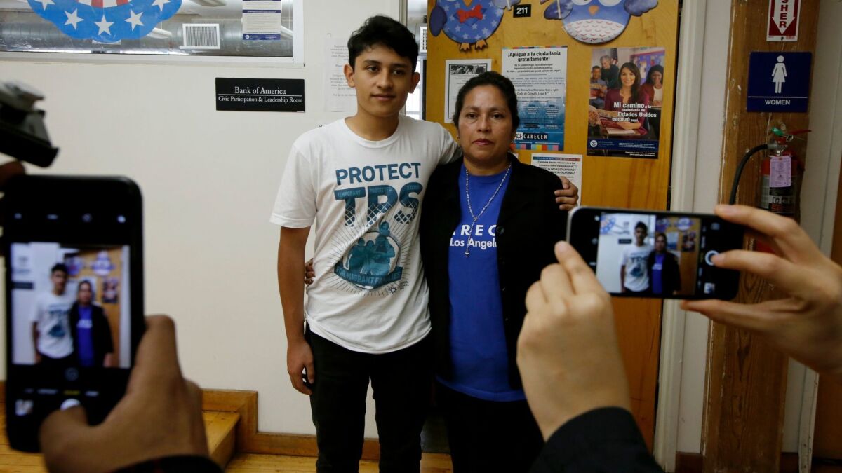 Lorena Zepeda, shown after a news conference Monday in Los Angeles with her 14-year-old son, Benjamin, benefits from Temporary Protected Status, as does her husband, Orlando. Benjamin is a U.S. citizen.