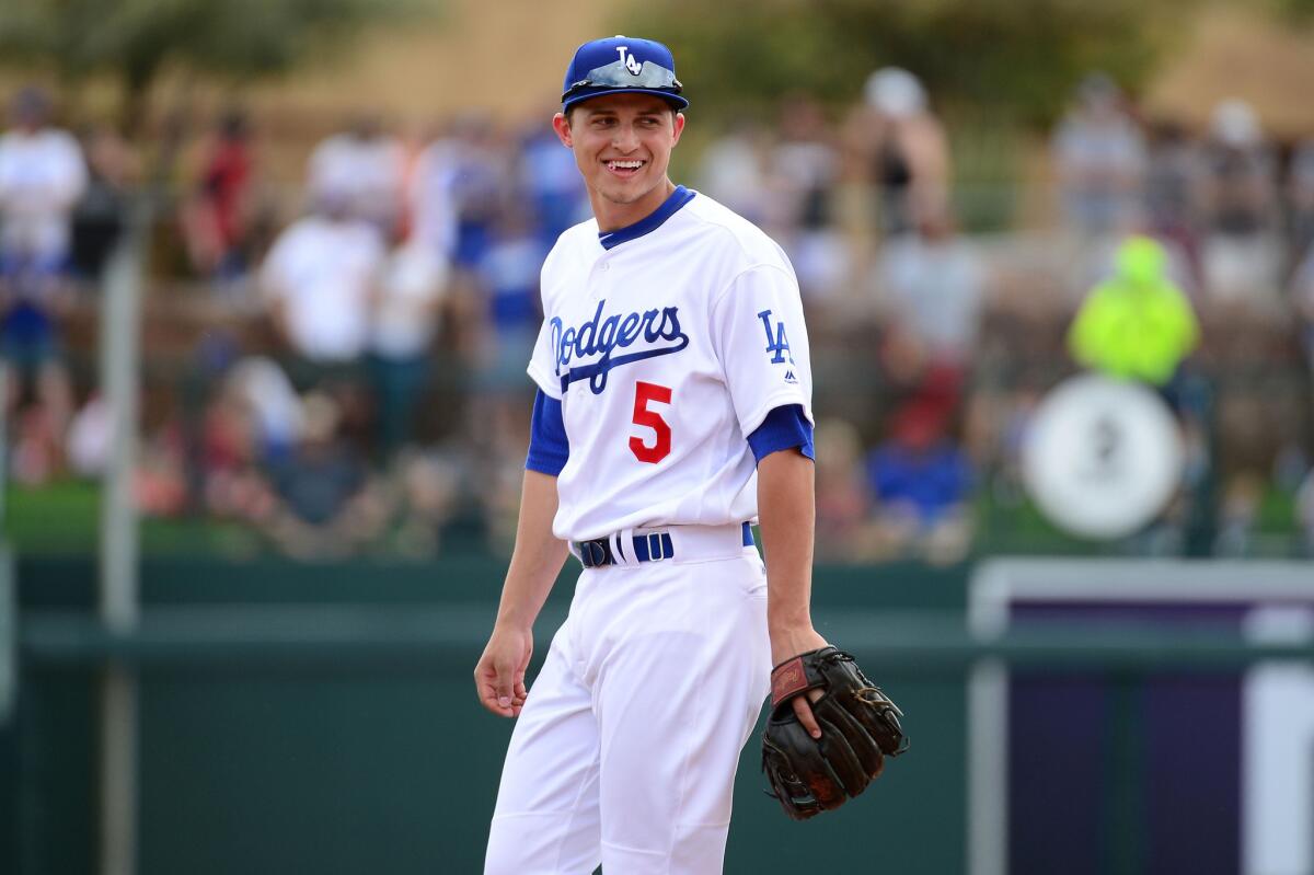 Dodgers infielder Corey Seager laughs on the field during a spring training game against the Diamondbacks at Camelback Ranch on March 5 in Glendale, Ariz.