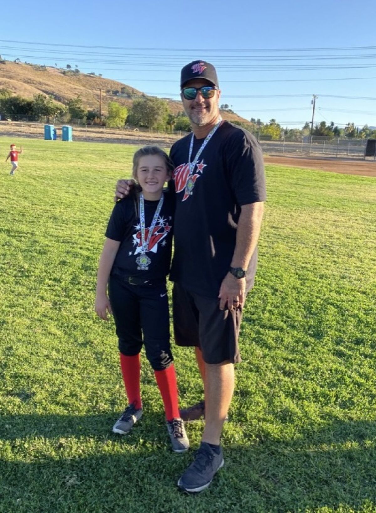 Former major league pitcher Jeff Suppan and daughter, Finley, an 11-year-old softball player.