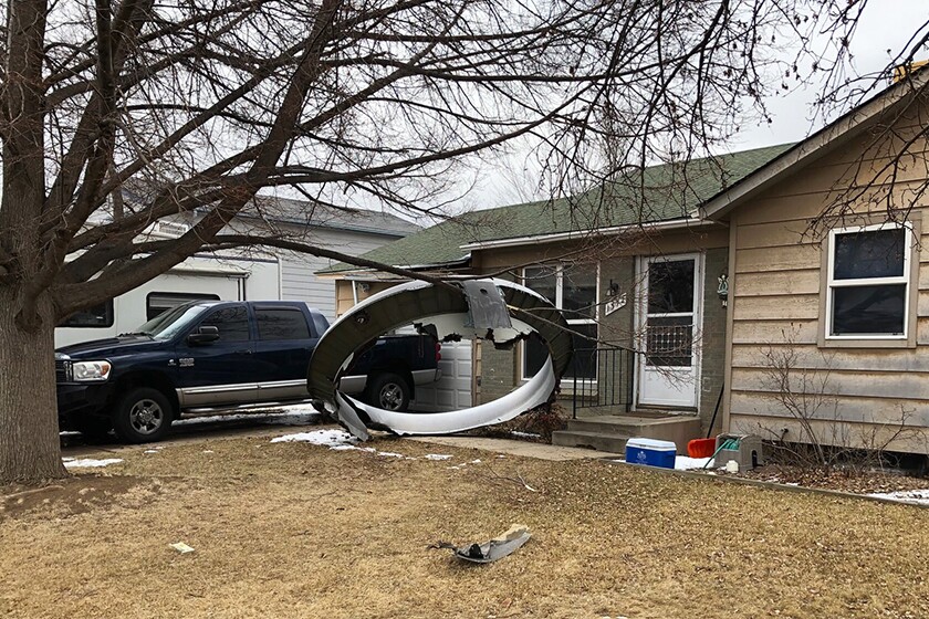 A piece of plane debris near a home.