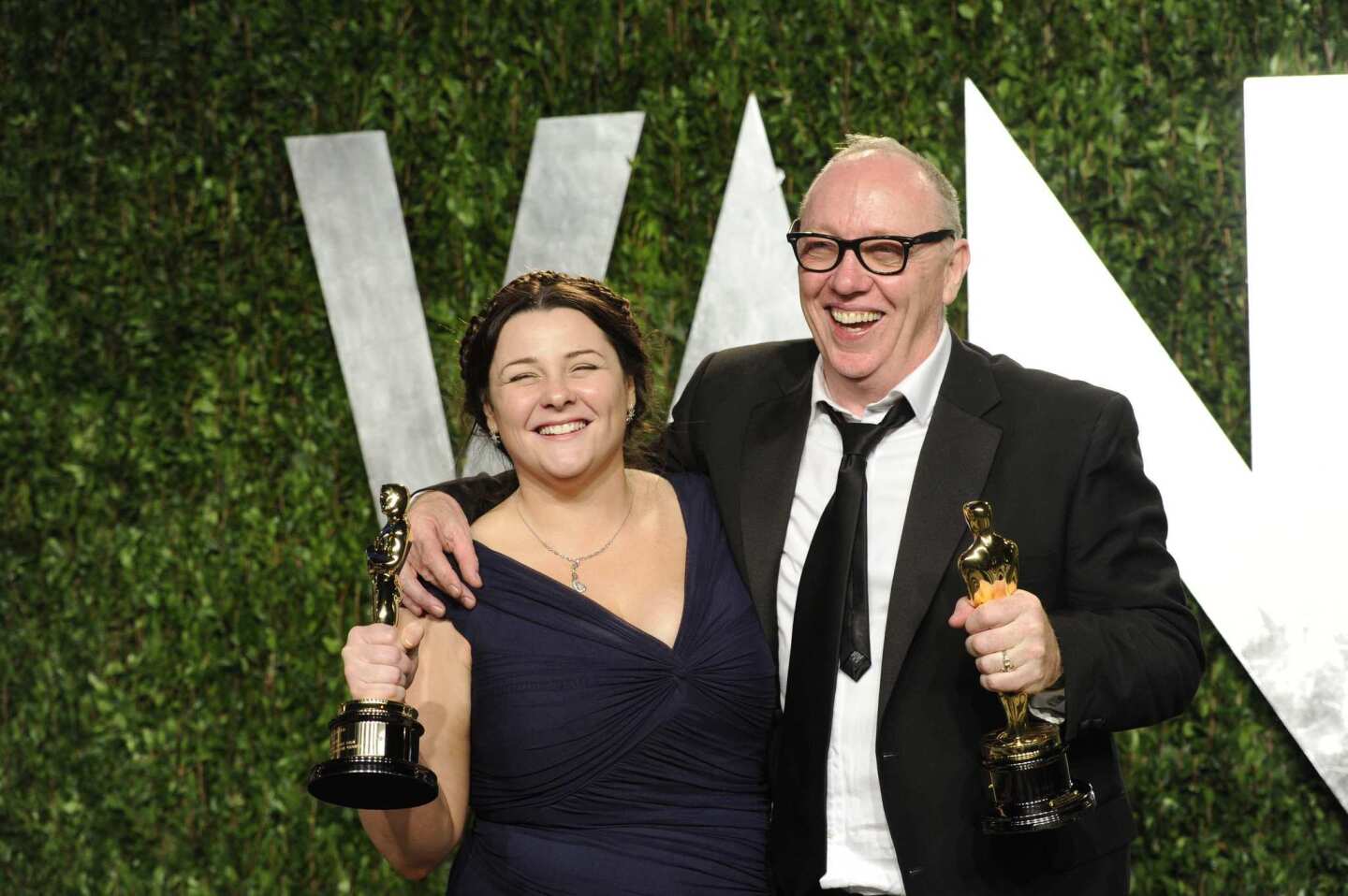 Oorlagh George, left, and Terry George pose with their Oscar statues. They won the Academy Award for their live-action short film "The Shore."