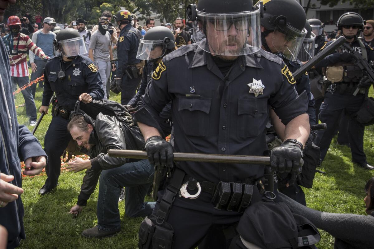 Supporters of President Trump clash with protesters during a Saturday rally in Berkeley.