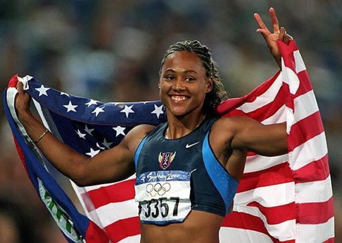 Marion Jones celebrates after winning the final of the women's 100m at the Sydney Olympic Games in 2000. The sprint superstar has admitted to using steroids before the '00 Games.