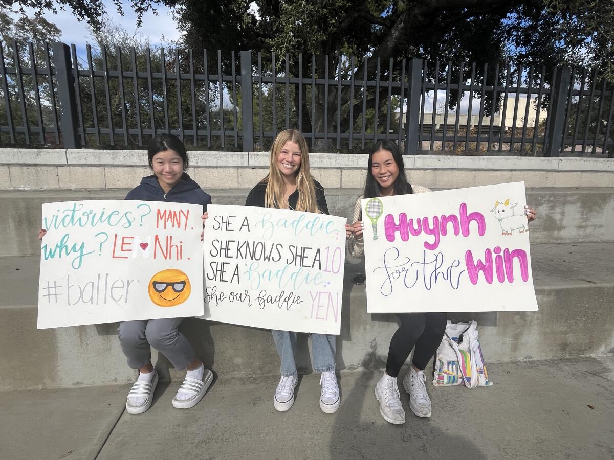 Huntington Beach High girls' tennis team members Jolin Wang, Cora Garrard and Cecelia Pham.