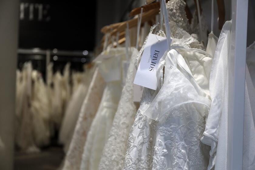 NEW YORK, NY - NOVEMBER 19: Wedding dresses are displayed in a window at a David's Bridal store in Manhattan on November 19, 2018 in New York City. The wedding dress retailer has filed for Chapter 11 bankruptcy protection on Monday. The company, which will continue to operate throughout bankruptcy, is coming to terms with changing consumer tastes in the wedding industry and a heavy debt load. (Photo by Spencer Platt/Getty Images) ** OUTS - ELSENT, FPG, CM - OUTS * NM, PH, VA if sourced by CT, LA or MoD **
