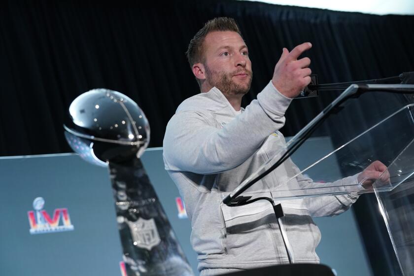 Los Angeles Rams head coach Sean McVay fields questions behind the Vince Lombardi trophy during a press conference following the NFL football team's Super Bowl win over the Cincinnati Bengals Monday, Feb. 14, 2022, in Los Angeles. (AP Photo/Marcio Jose Sanchez)