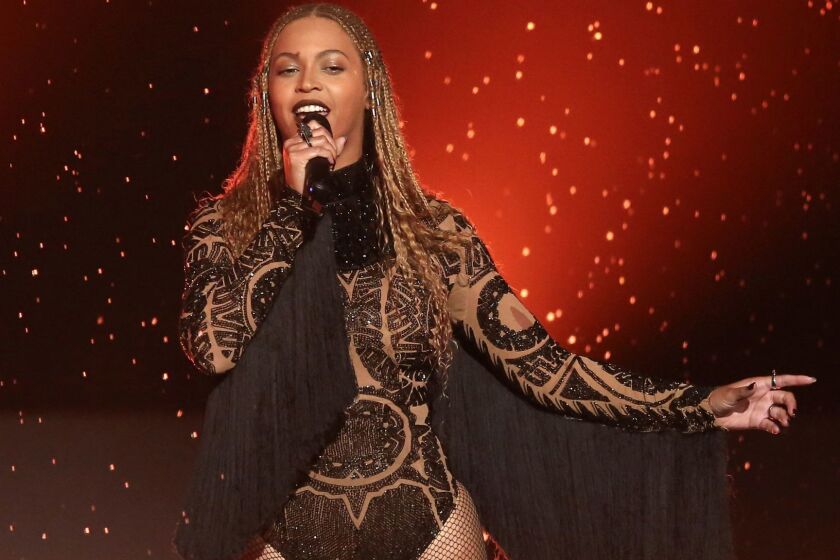 FILE - In this June 26, 2016, file photo, Beyonce performs "Freedom" at the BET Awards in Los Angeles. A wax figure of Beyonce at Madame Tussauds in New York has been given a makeover after fans of the megastar said the figure was too white. Madame Tussauds said in a statement Friday, July 21, 2017, that the wax Beyonce was back on display after adjustments to "the styling and lighting of her figure." (Photo by Matt Sayles/Invision/AP, File)