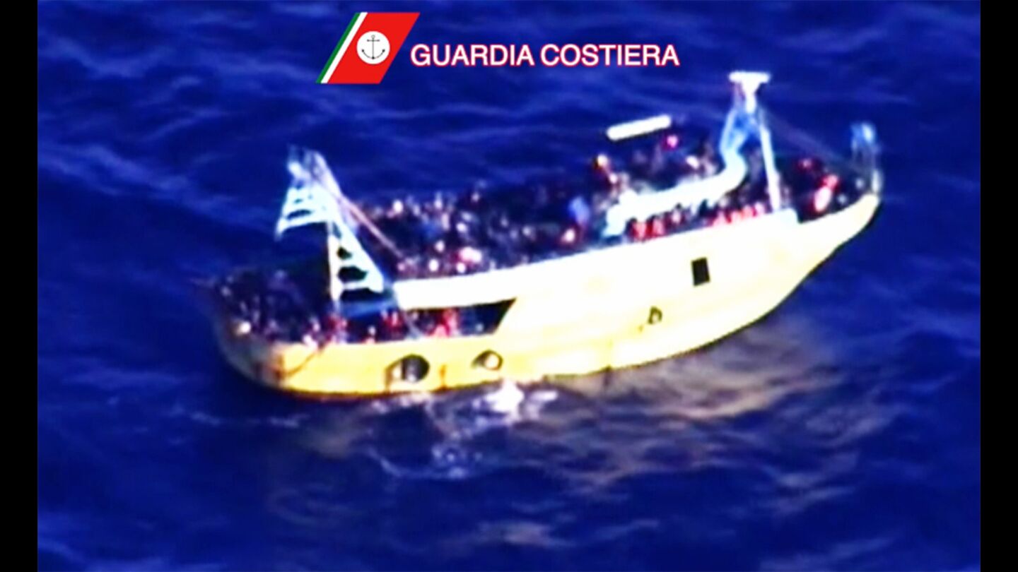 A boat off the coast of Calabria, Italy, carries 446 migrants who were rescued early on Tuesday.