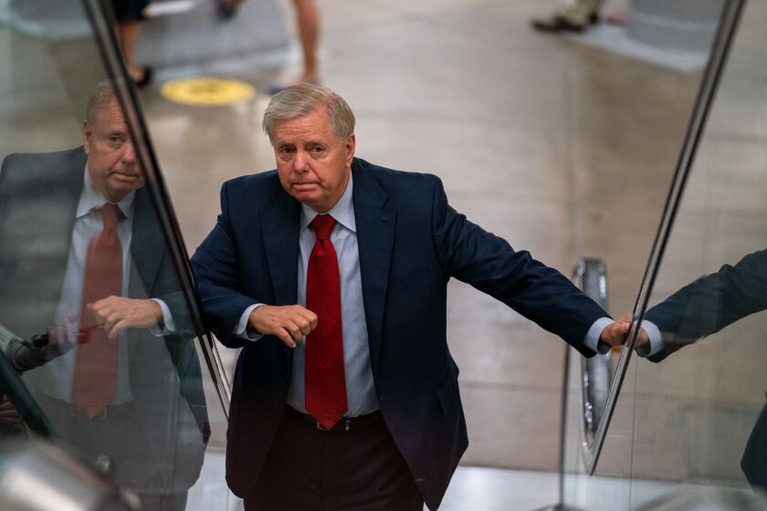 WASHINGTON, DC - JULY 21:Sen. Lindsey Graham (R-SC) answers questions from reporters while on his way to a vote on Capitol Hill on Wednesday, July 21, 2021. (Kent Nishimura / Los Angeles Times)