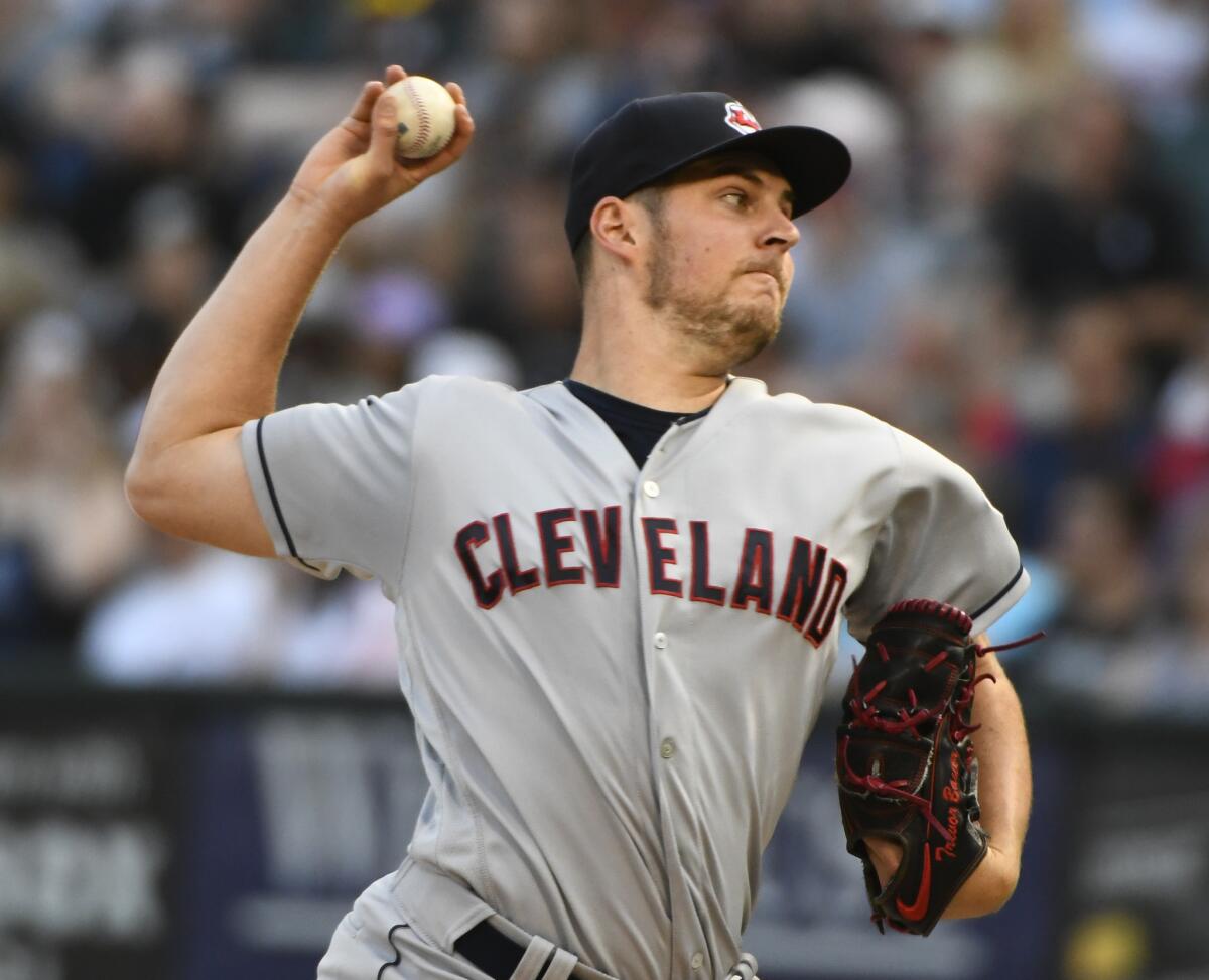 Cleveland Indians starting pitcher Trevor Bauer delivers against the Chicago White Sox during the first inning in Chicago.