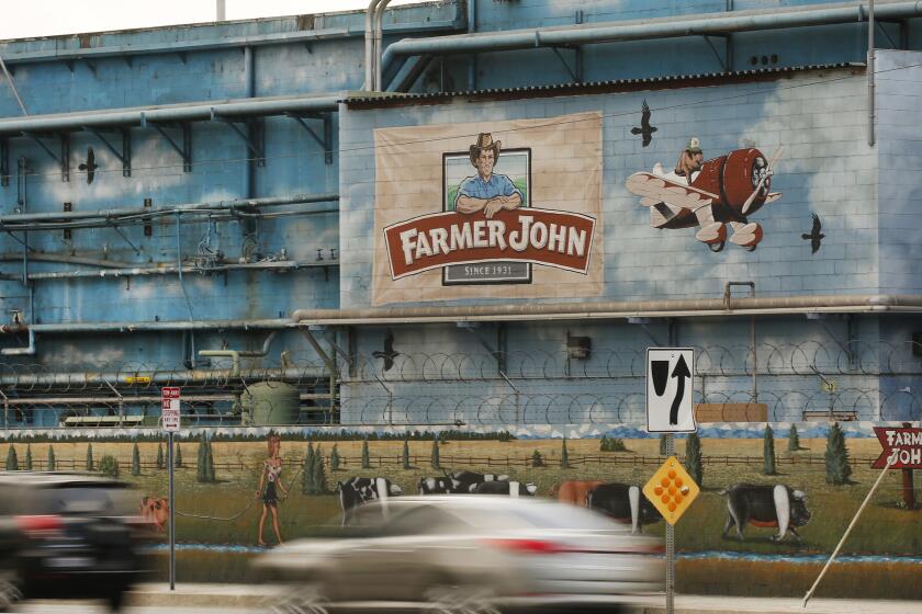 VERNON, CA - NOVEMBER 3, 2017: Farmer John located at Soto St and E. 37th Street in Vernon Friday November 3, 2017 as air quality officials are expected to adopt new rules aimed at easing foul odors from animal rendering plants. Nearby Boyle Heights residents have long complained for about stomach-churning odors wafting over from five Vernon-area rendering plants, which take animal parts from slaughterhouses and cook them down into fats and proteins that are used to make pet food, fertilizer, cosmetics and products. The new standards, which took over three years for regulators to develop amid pushback from the industry, will require facilities enclose some of their outdoor animal processing operations, use odor-control equipment and take other steps to minimize offensive odors. (Al Seib / Los Angeles Times)