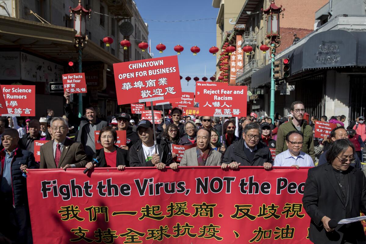 Hundreds of Chinatown residents along with local and state officials protest racism against the Chinese community during a march in San Francisco on Feb. 29.