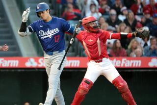 ANAHEIM, CALIFORNIA - MARCH 26: Dodgers Shohei Ohtani strikes out in the fourth inning.