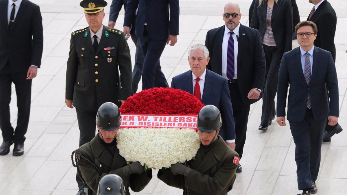 U.S. Secretary of State Rex Tillerson, center, attends a wreath-laying ceremony at Anitkabir, the mausoleum of Turkey's modern founder, Mustafa Kemal Ataturk, in Ankara.