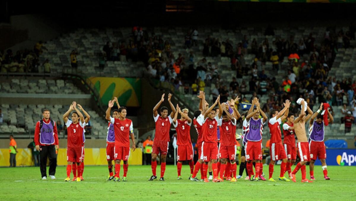 Players of Tahiti applaud supporters after the match between Tahiti and Nigeria at the Mineirao Stadium in Belo Horizonte, Brazil.