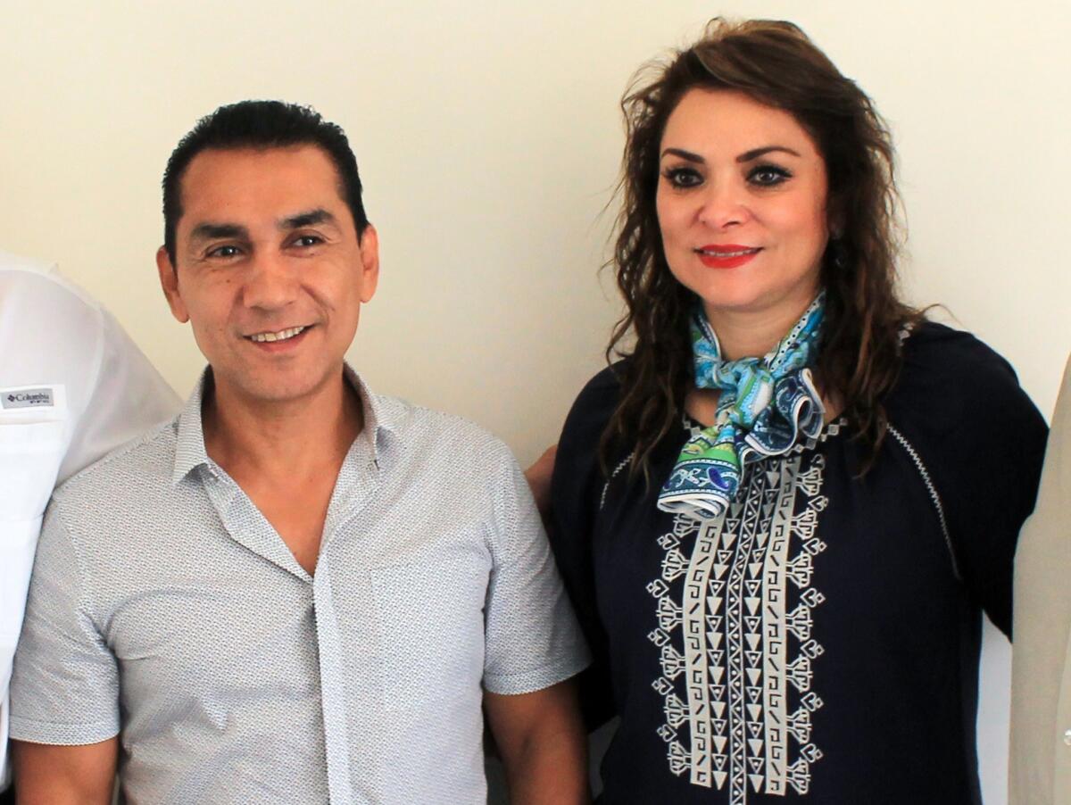 Iguala Mayor Jose Luis Abarca and his wife, Maria de Los Angeles Pineda, attend an event at the Municipal Palace in Iguala, Mexico on July 3.