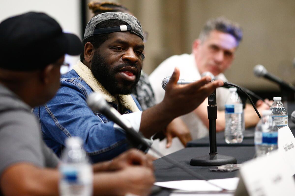 Greg Mack, Hanif Abdurraqib, Times writer Gerrick D. Kennedy and Will Ashton speak on a panel at the annual Los Angeles Times Festival of Books at USC.