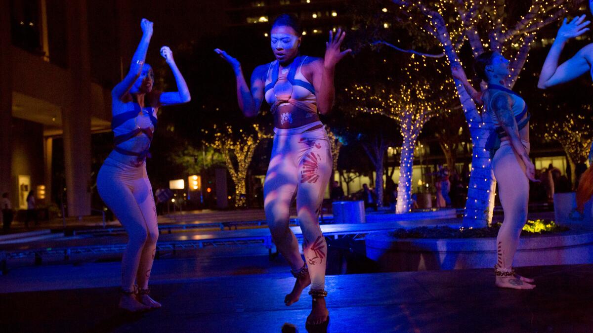 Blue13 Dance Company performs "Among Whispers" on the Music Center Plaza during the Moves After Dark program Monday.