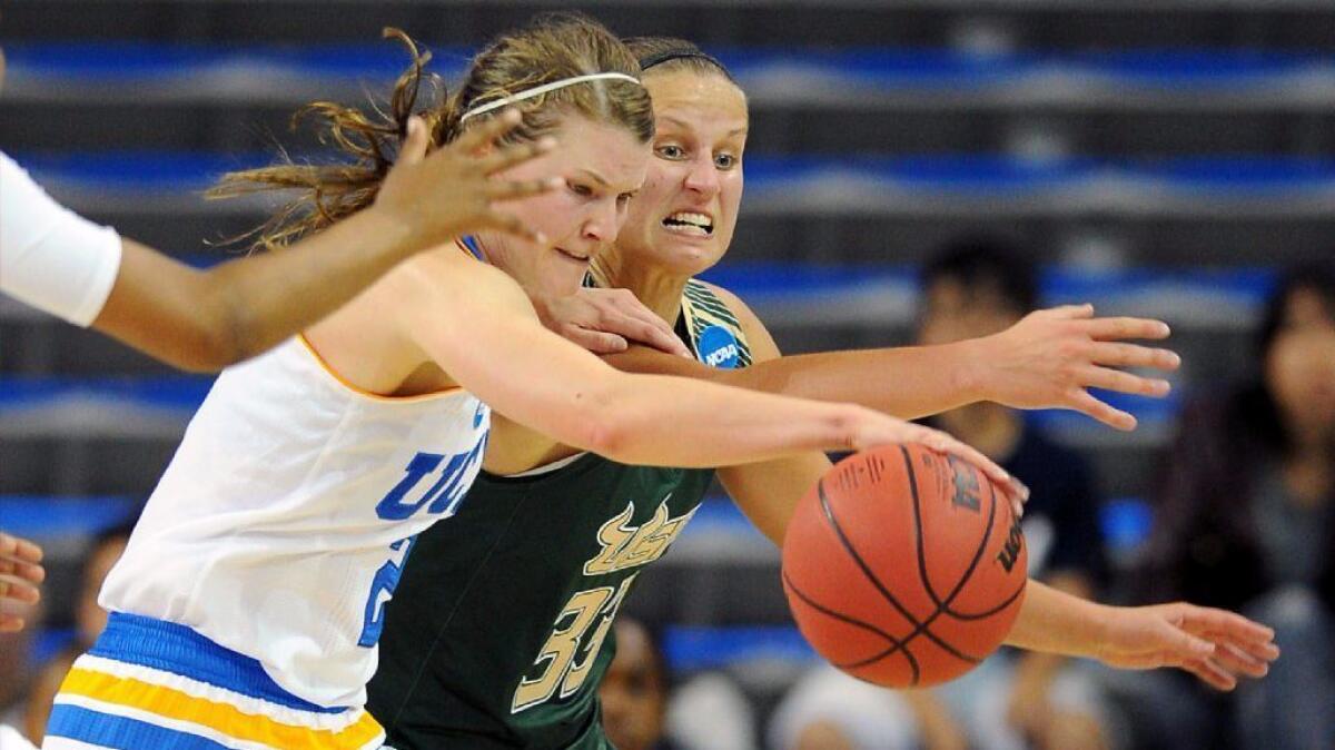 UCLA guard Kari Korver, left, and battles with South Florida's Kitija Laksa (33) for a loose ball during a second-round women's NCAA Tournament game on Mar. 21, 2016.