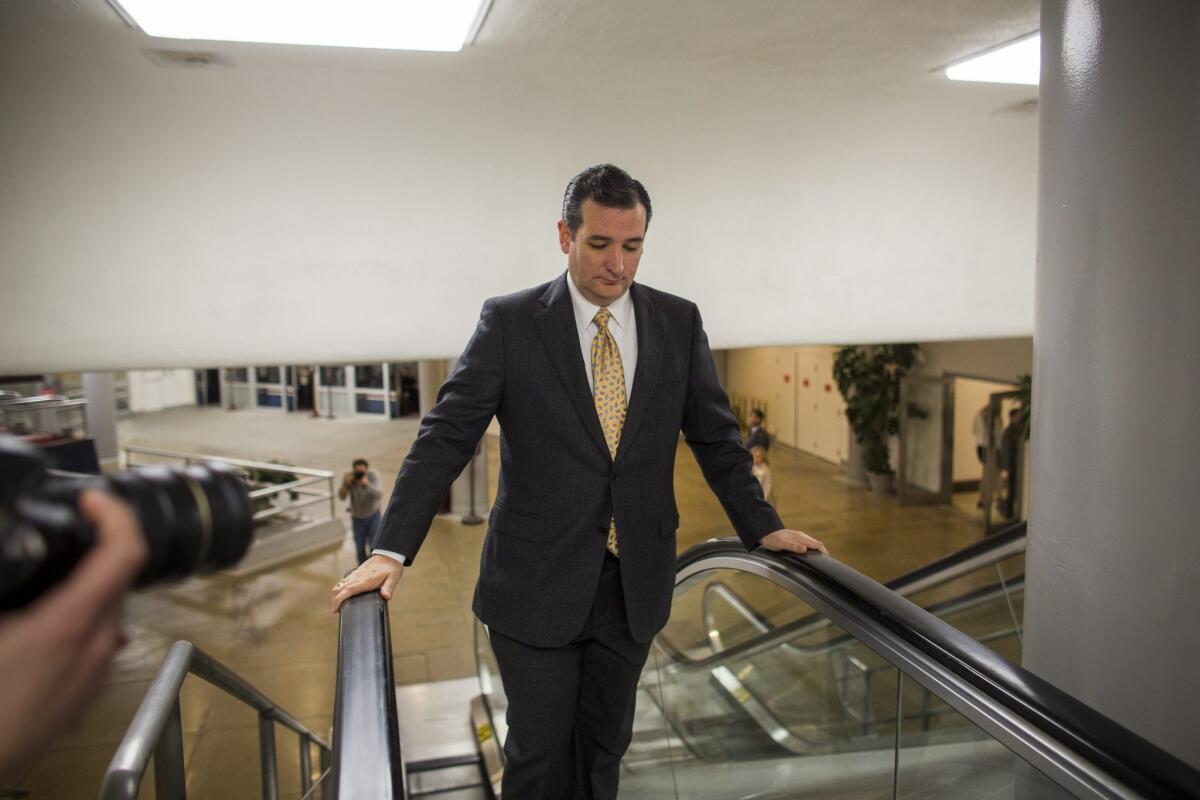Sen. Ted Cruz (R-Texas), who spearheaded a filibuster against the vote to raise the debt limit, heads to the Senate floor.